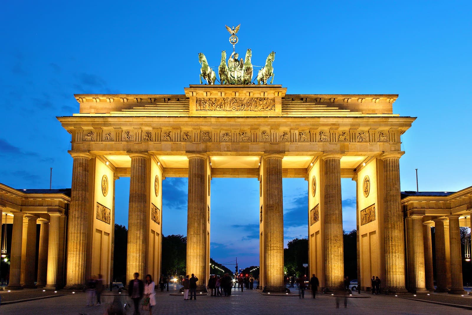 The Brandenburg Gate illuminated at dusk in Berlin